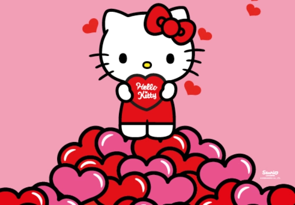 Hello Kitty steht auf Herzen und hält rotes Herz