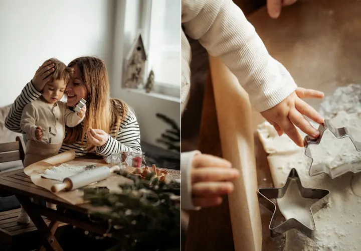 Ein Kind und ein Erwachsener backen gemeinsam an einem Holztisch, stechen mit Ausstechformen Plätzchen aus ausgerolltem Teig – in einer gemütlich dekorierten Küche.
